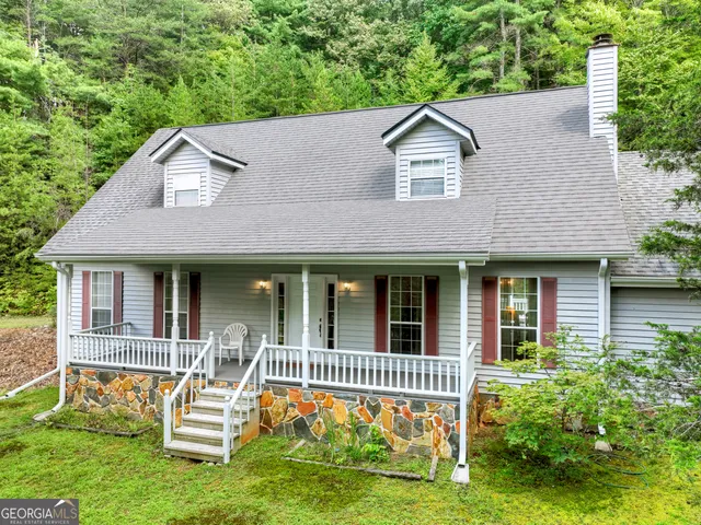 a aerial view of a house with a yard