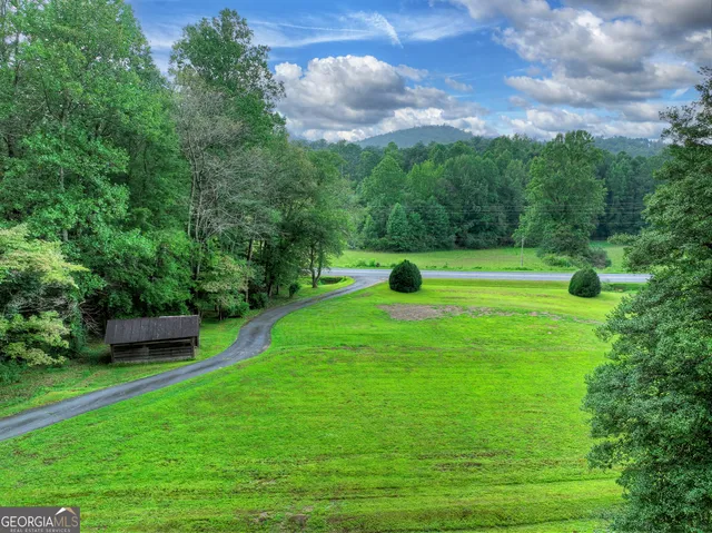 a view of a garden with a building