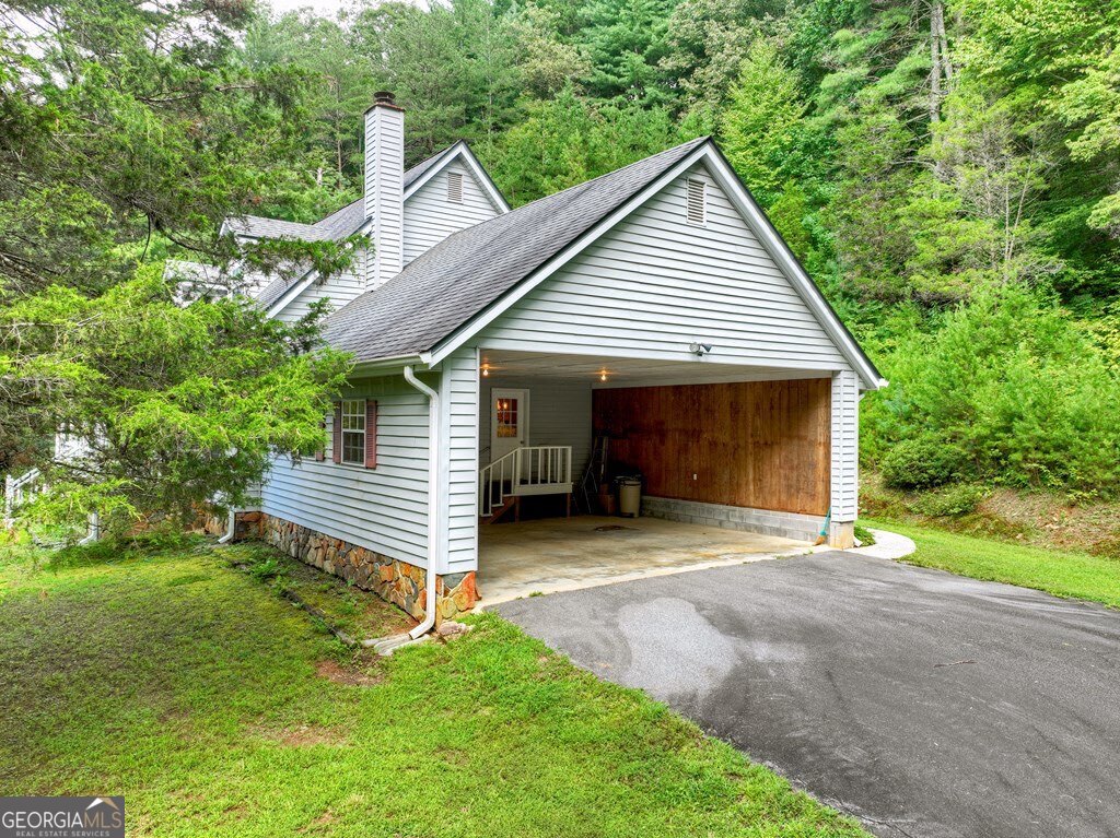 1362 Cherry Log Street Cherry Log, GA 30522 - Photo 5 of 55 a front view of a house with a garden and yard