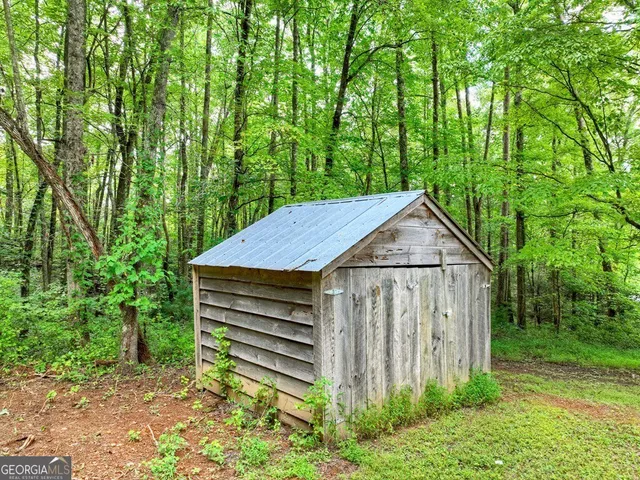 a house with trees in the background
