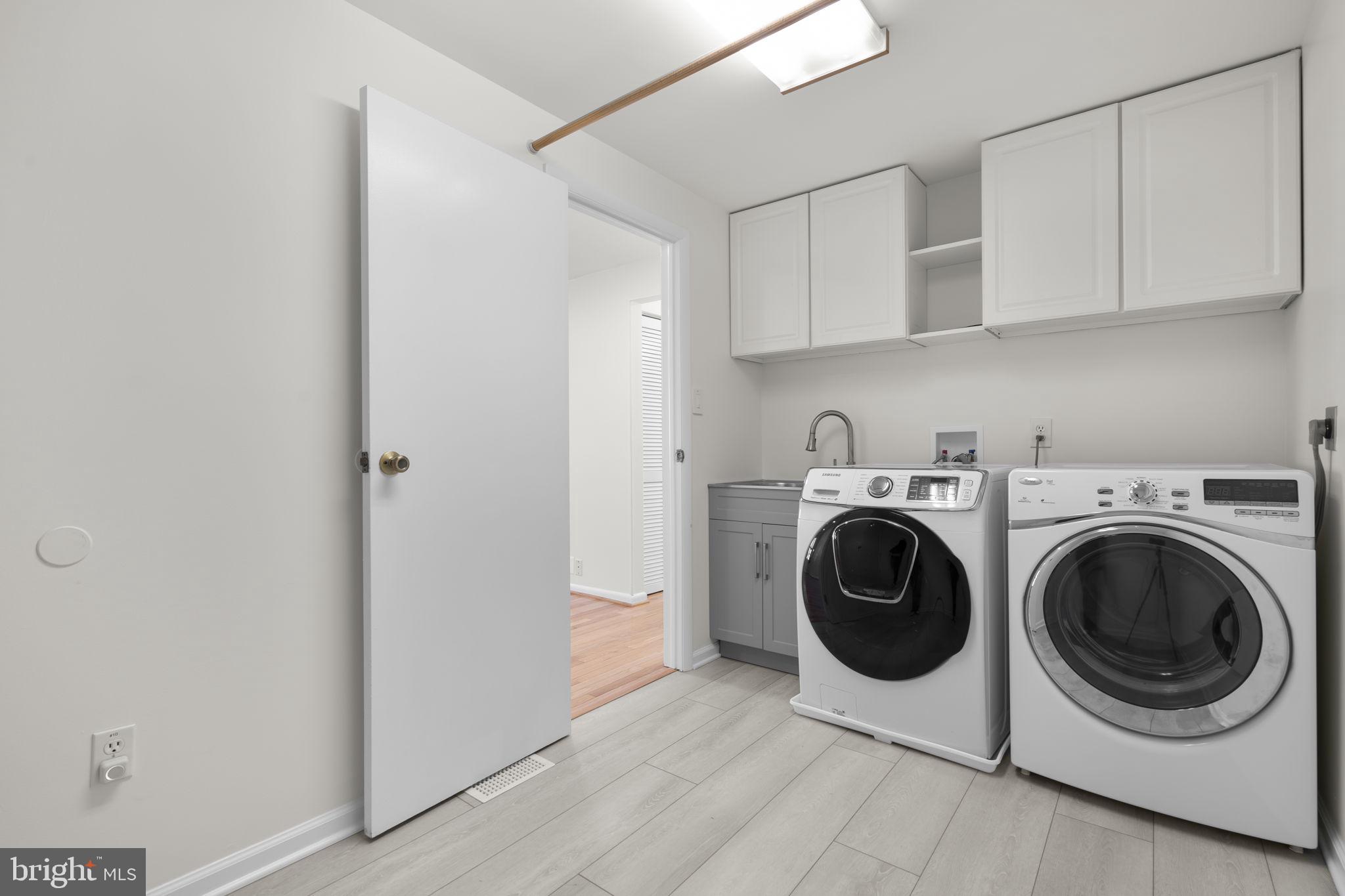 108 North Garfield Road Sterling, VA 20164 - Photo 11 of 31 Laundry rm w/cabinets, sink & rod to hang clothes