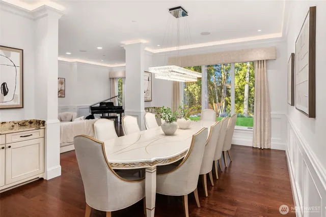 a view of a dining room with furniture window and wooden floor