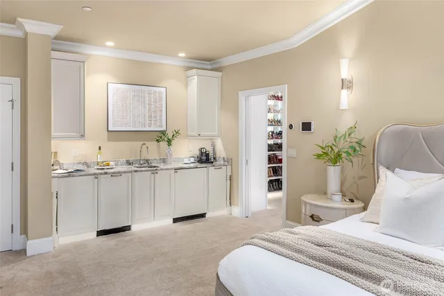 a bedroom with a bed and a couch