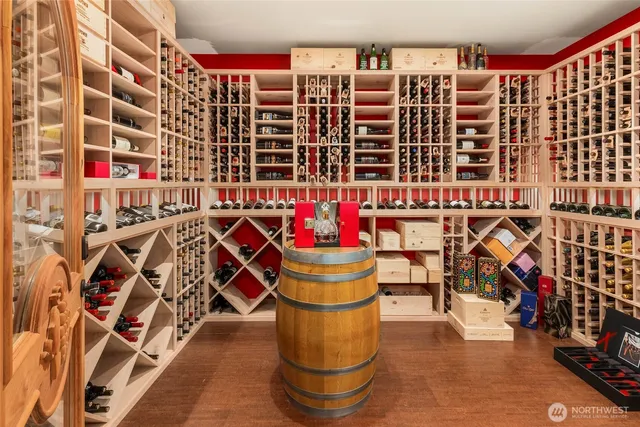 a city street filled with lots of traffic and tall trees