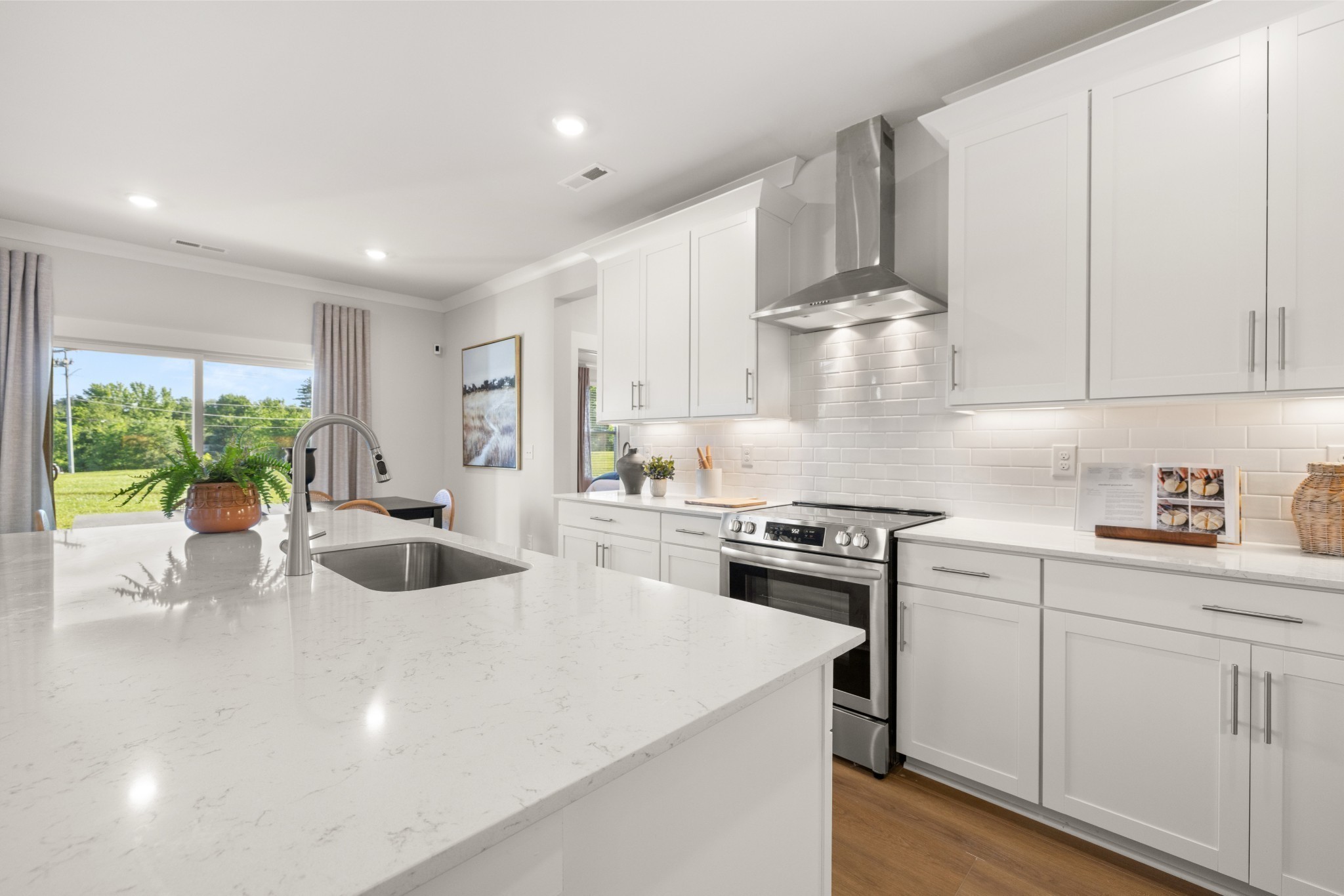 401 Mclemore Ridge Clarksville, TN 37043 - Photo 17 of 64 a kitchen with a stove a sink a microwave and cabinets