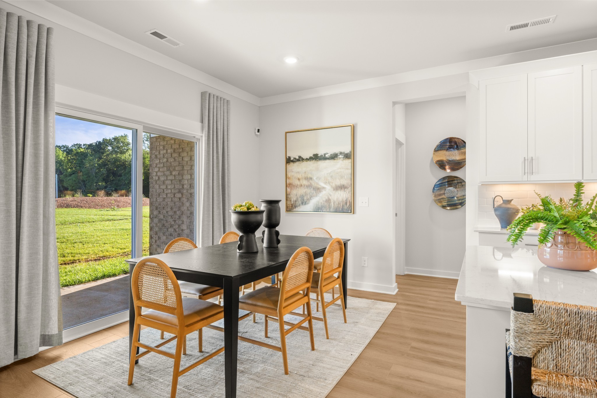 401 Mclemore Ridge Clarksville, TN 37043 - Photo 26 of 64 a view of a dining room with furniture and a potted plant