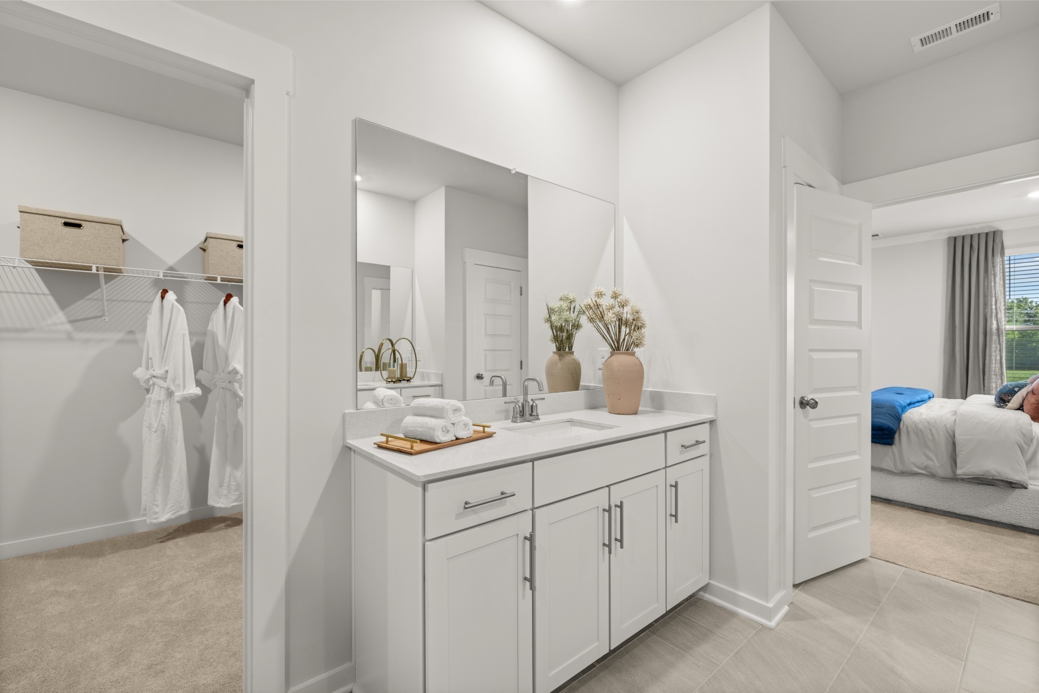 401 Mclemore Ridge Clarksville, TN 37043 - Photo 37 of 64 a spacious bathroom with a double vanity sink and a mirror