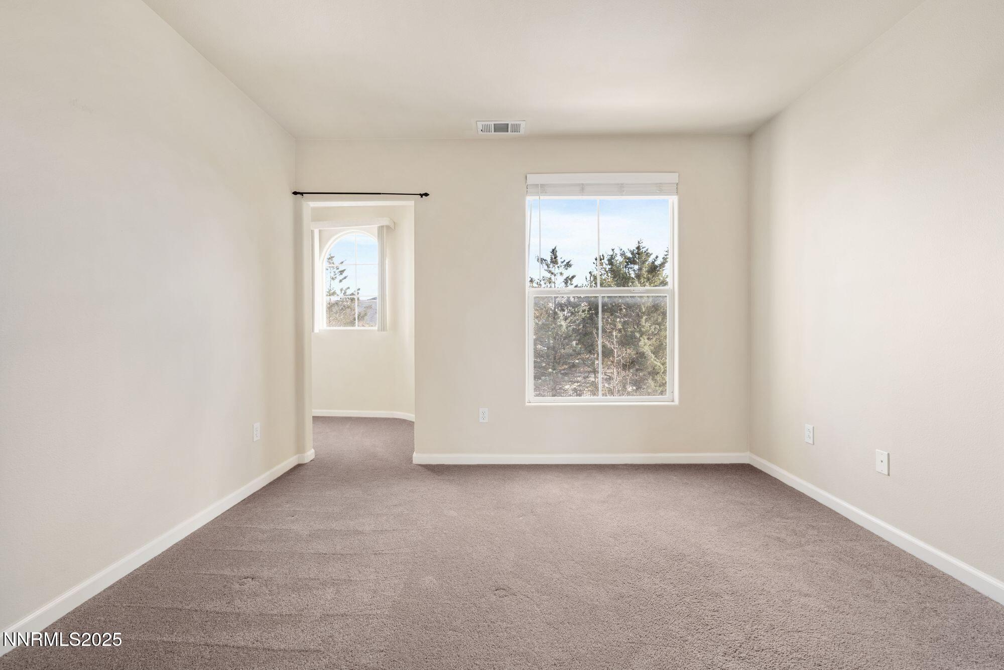 1325 South Meadows Parkway, Unit 224 Reno, NV 89521 - Photo 16 of 29 an empty room with windows and closet