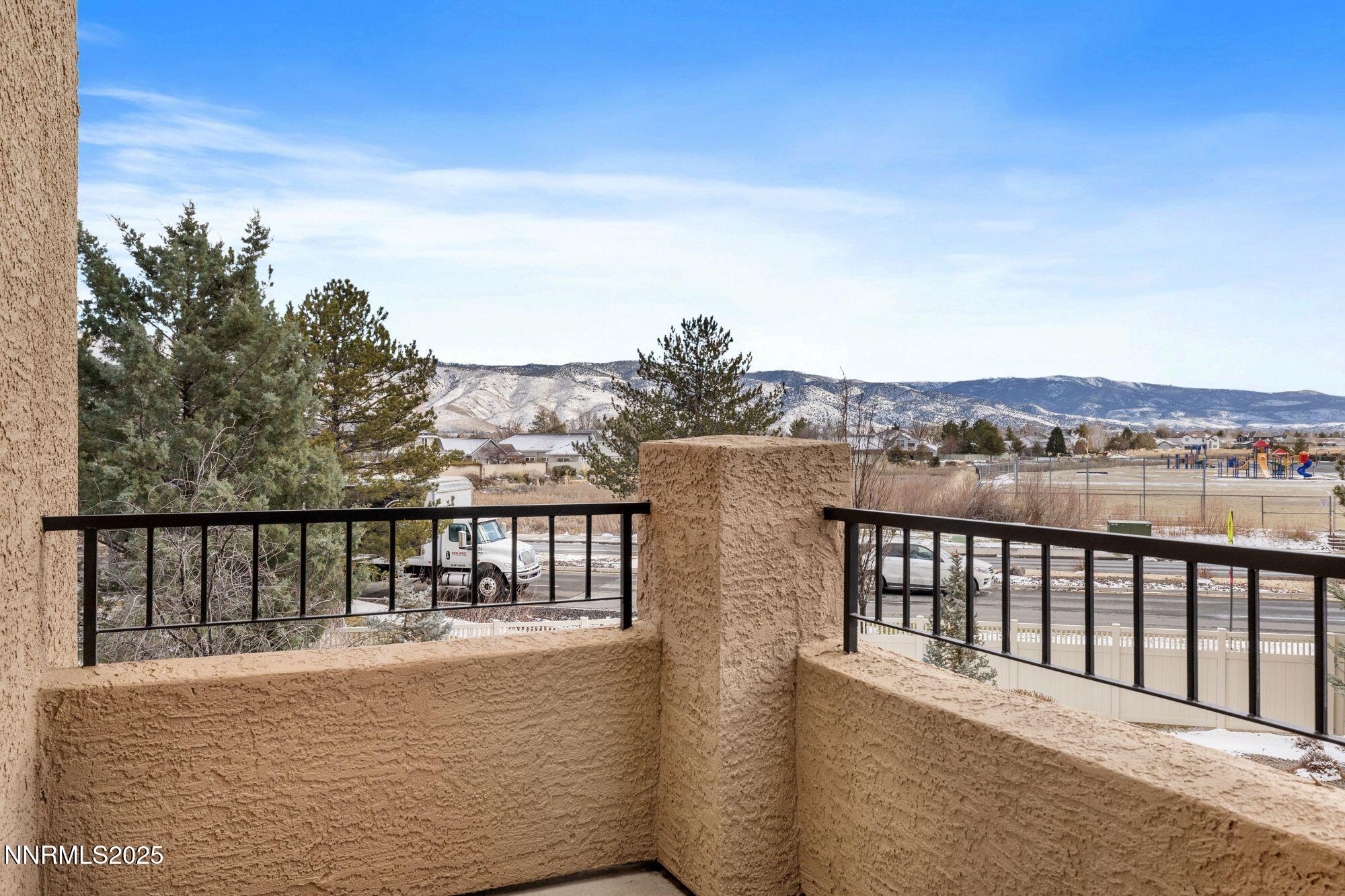 1325 South Meadows Parkway, Unit 224 Reno, NV 89521 - Photo 25 of 29 a view of a balcony with an ocean view