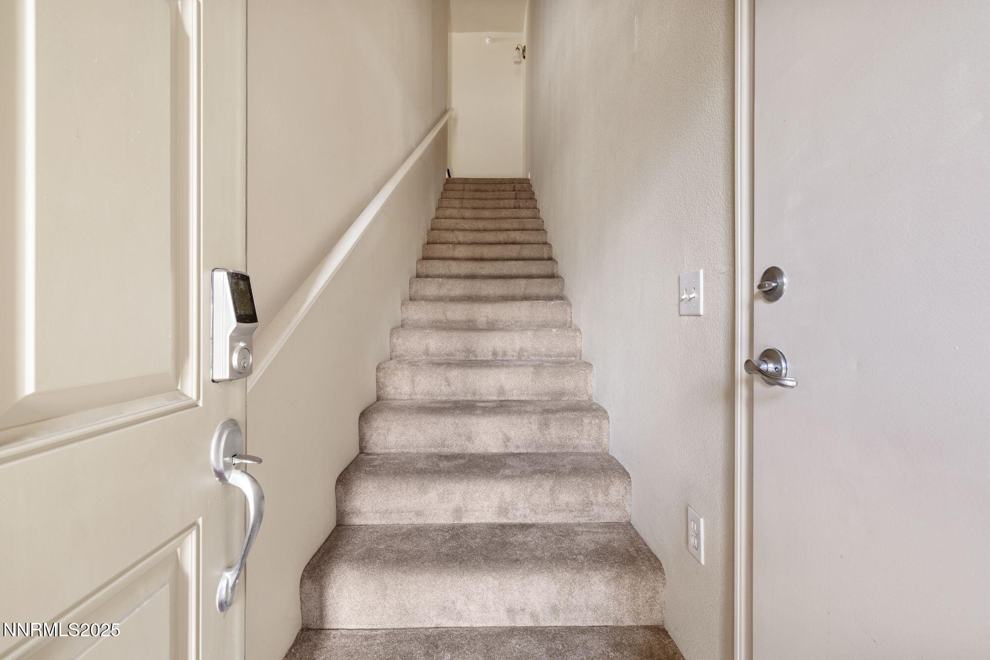 1325 South Meadows Parkway, Unit 224 Reno, NV 89521 - Photo 27 of 29 a view of staircase with white walls and white walls