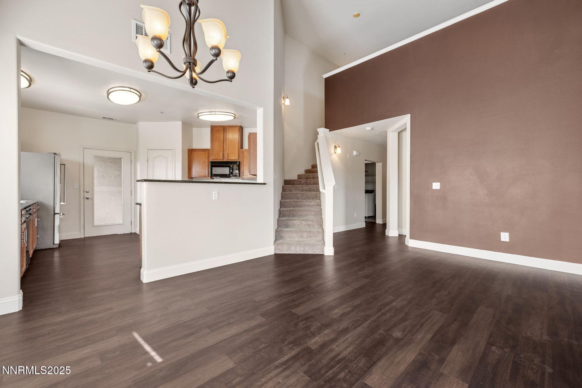 1325 South Meadows Parkway, Unit 224 Reno, NV 89521 - Photo 3 of 29 a view of a livingroom with wooden floor