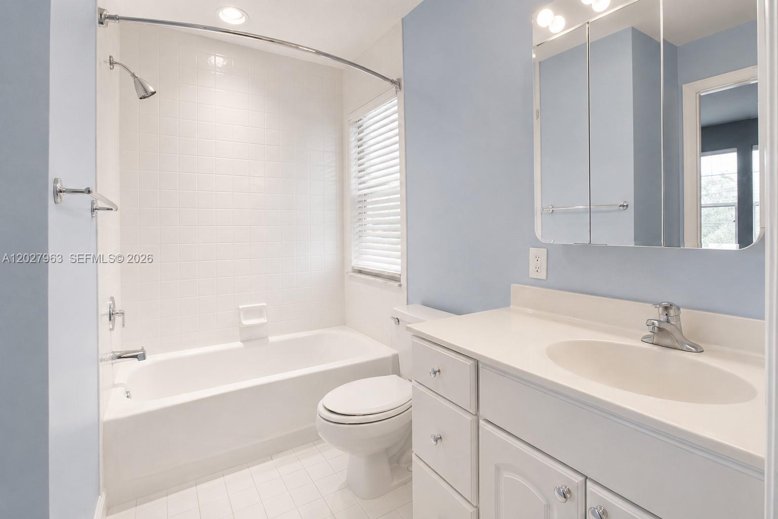 6646 Northwest 25th Terrace Boca Raton, FL 33496 - Photo 25 of 48 a bathroom with a sink a toilet and shower