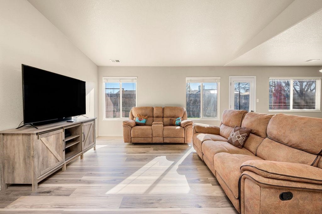 312 Catkin Street Fruita, CO 81521 - Photo 3 of 40 a living room with furniture and a flat screen tv