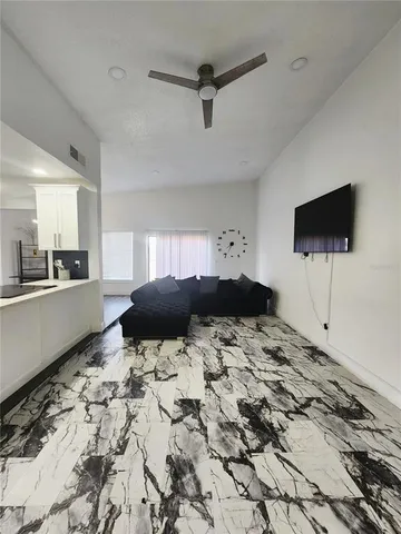 a living room with a couch and a flat screen tv