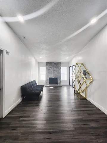 a view of a livingroom with furniture and wooden floor