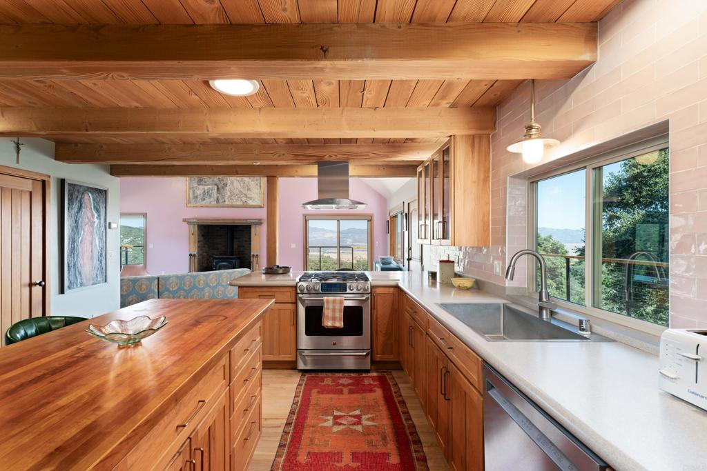 25770 East Grade Road Santa Ysabel, CA 92070 - Photo 3 of 75 a large kitchen with kitchen island a large window in it