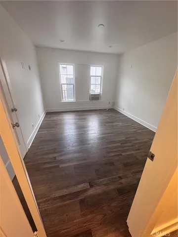 a view of room and wooden floor