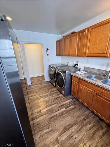 a view of a kitchen with a sink and cabinets