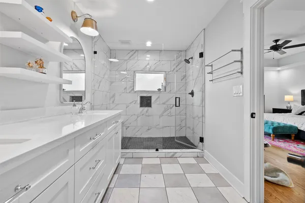 a bathroom with a sink a mirror and a bathtub