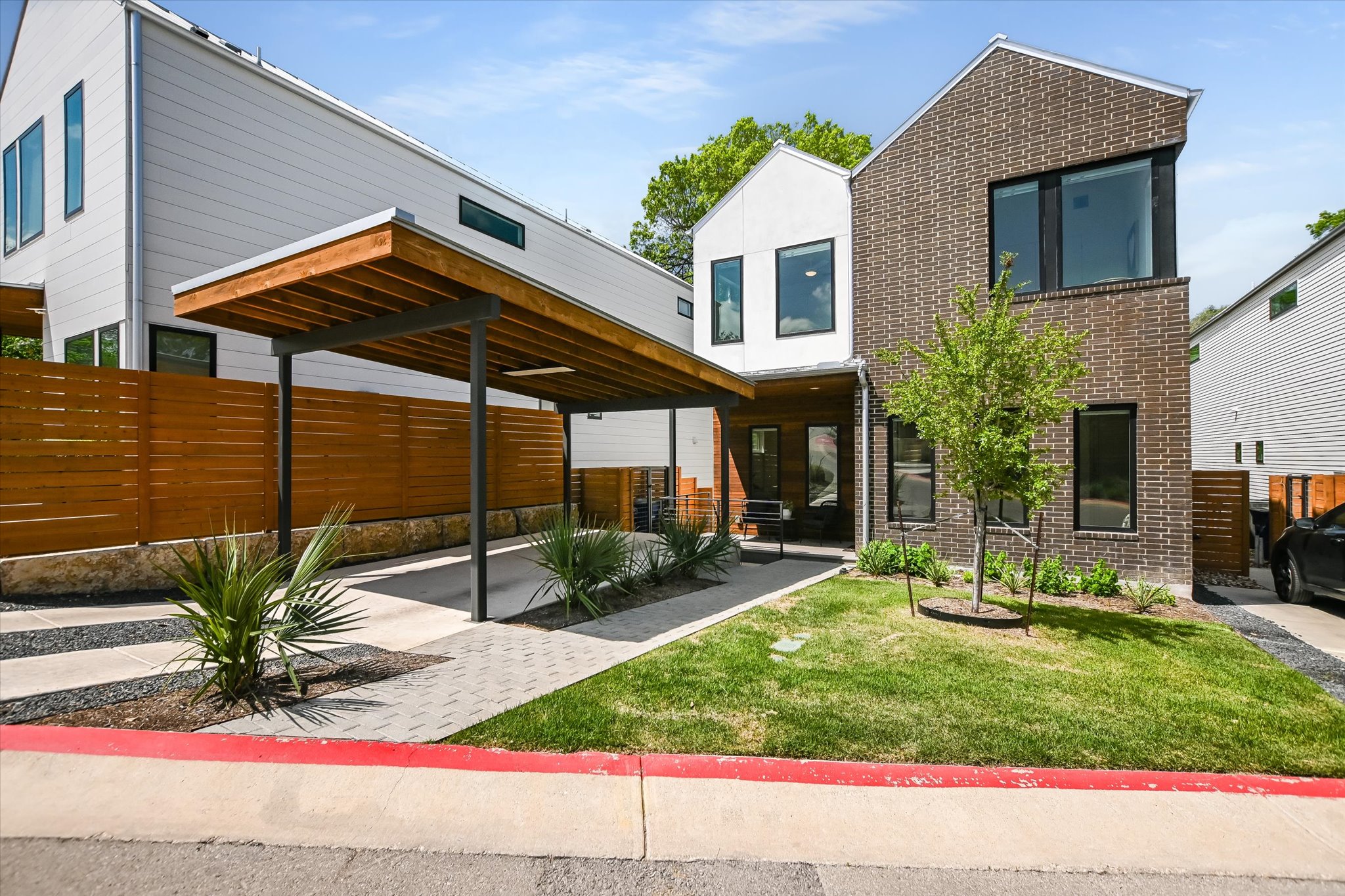 900 South 2nd Street, Unit 6 Austin, TX 78704 - Photo 1 of 25 a view of a house with backyard and sitting area