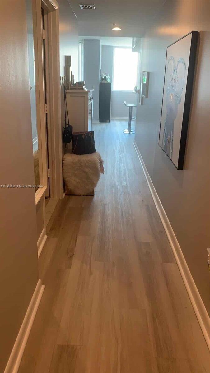 244 Biscayne Boulevard, Unit 608 Miami, FL 33132 - Photo 15 of 25 a view of a kitchen from the hallway