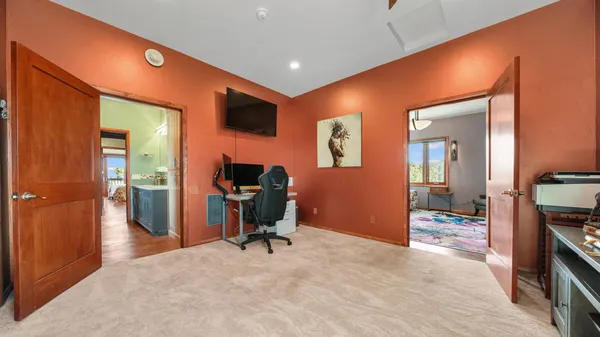 a room with furniture and a flat screen tv