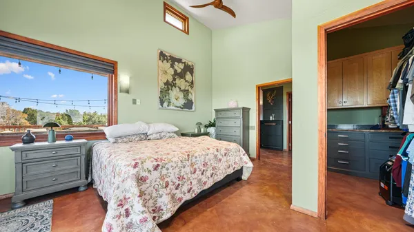 a bedroom with a bed and a dresser