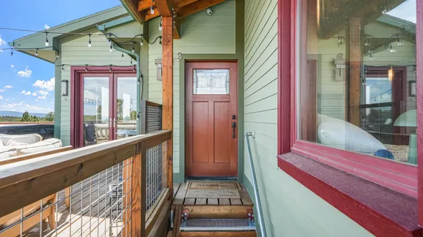 a room with a door and a wooden floor