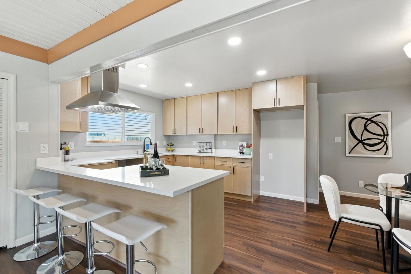 3612 Los Flores Avenue Concord, CA 94519 - Photo 22 of 65 a kitchen with a dining table chairs and refrigerator