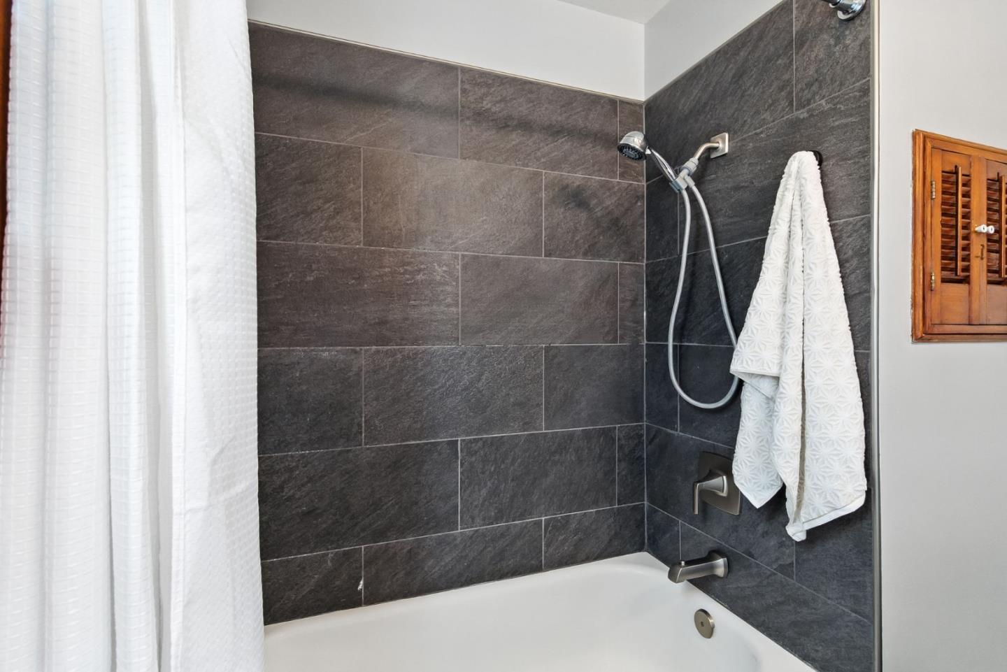 3612 Los Flores Avenue Concord, CA 94519 - Photo 29 of 65 a bathroom with a shower and a tiled wall