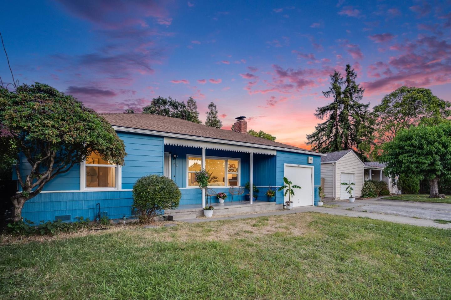 3612 Los Flores Avenue Concord, CA 94519 - Photo 40 of 65 a front view of a house with a yard and garage