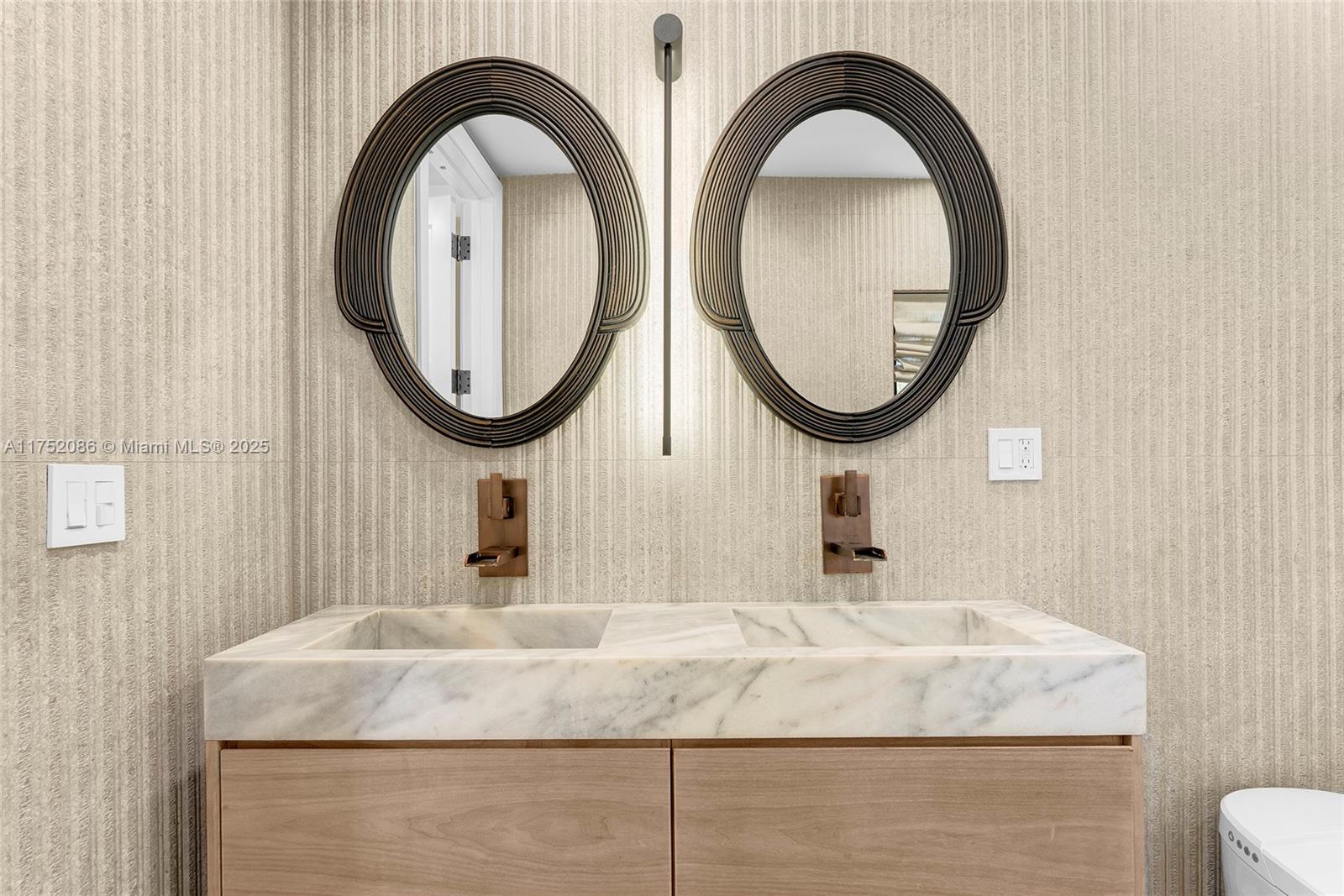 6146 Pine Tree Drive Miami Beach, FL 33140 - Photo 15 of 30 a bathroom with mirror and sink