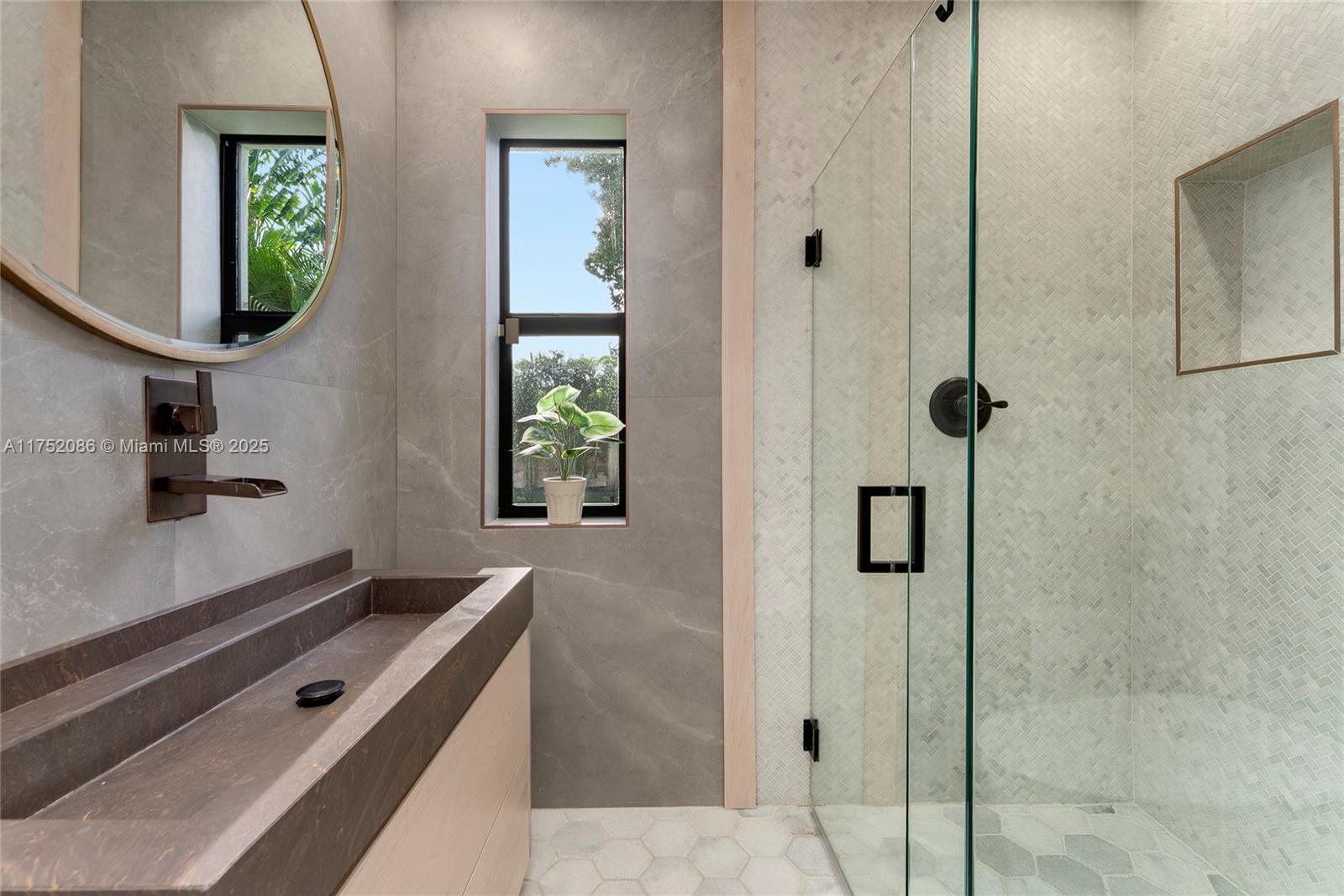 6146 Pine Tree Drive Miami Beach, FL 33140 - Photo 23 of 30 a bathroom with a bathtub a shower and mirror