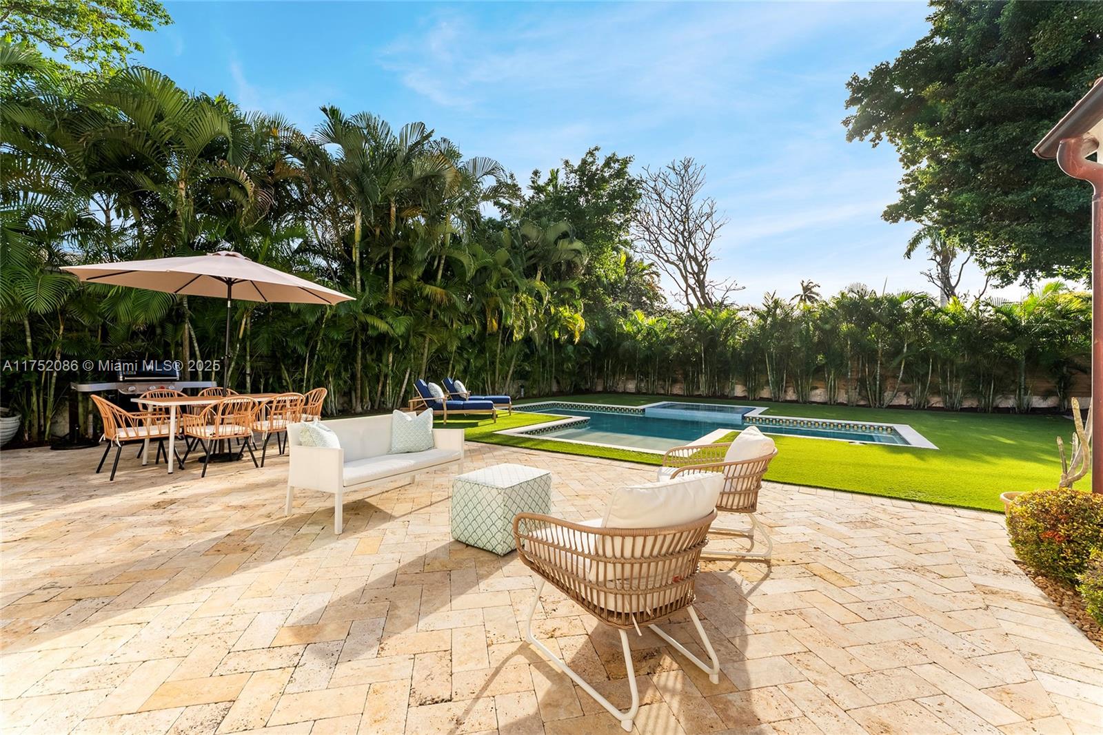 6146 Pine Tree Drive Miami Beach, FL 33140 - Photo 25 of 30 a view of swimming pool with chairs