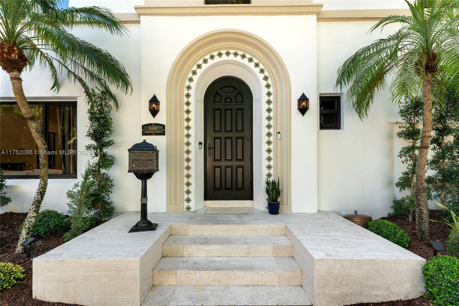 6146 Pine Tree Drive Miami Beach, FL 33140 - Photo 3 of 30 a view of entryway with garden