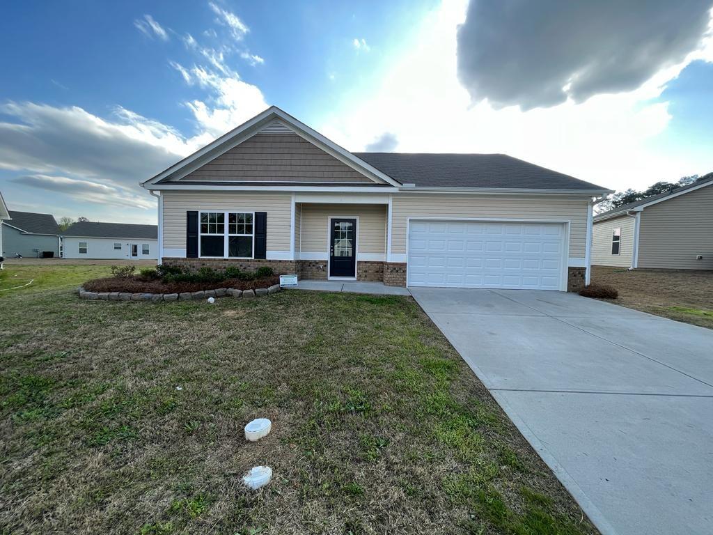 4 Bayberry Circle Southwest Rome, GA 30165 - Photo 1 of 1 a backyard of a house with yard and outdoor seating