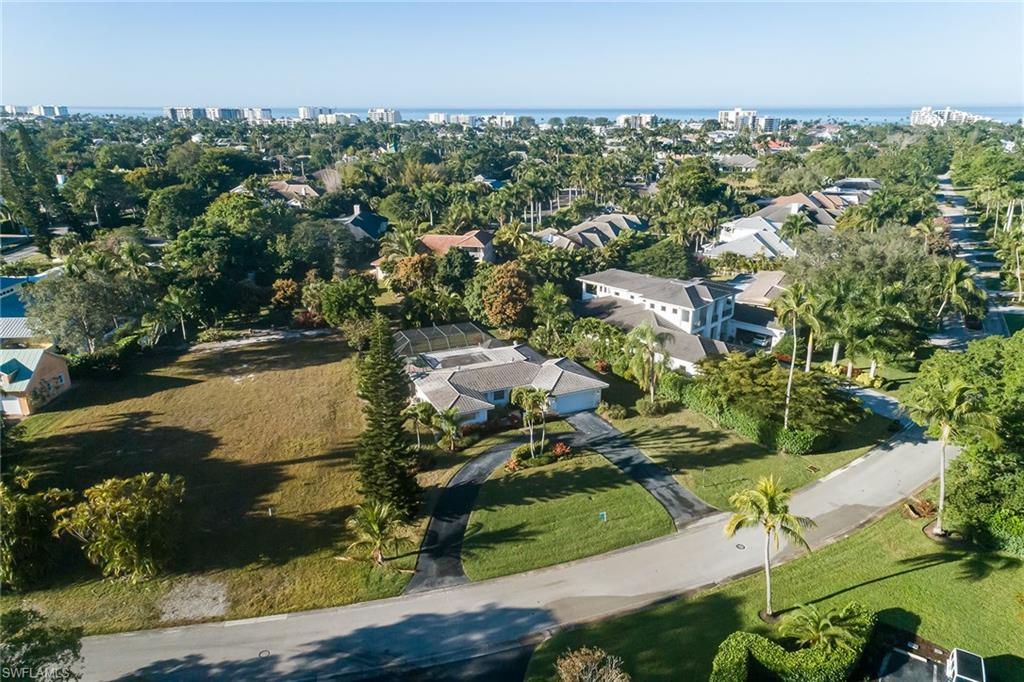 700 Bow Line Drive Naples, FL 34103 - Photo 11 of 18 an aerial view of residential houses with outdoor space and trees