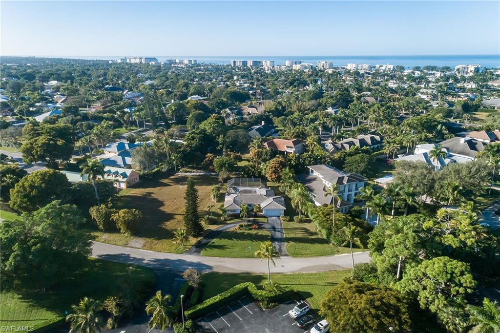700 Bow Line Drive Naples, FL 34103 - Photo 5 of 18 an aerial view of residential houses with outdoor space and trees