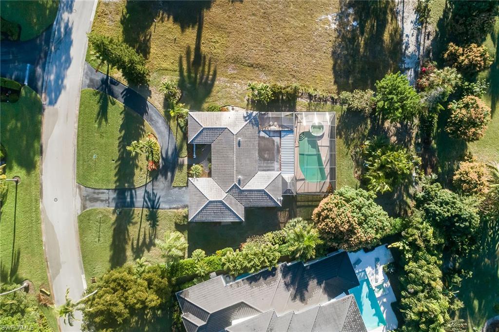 700 Bow Line Drive Naples, FL 34103 - Photo 8 of 18 an aerial view of a house with a yard and garden