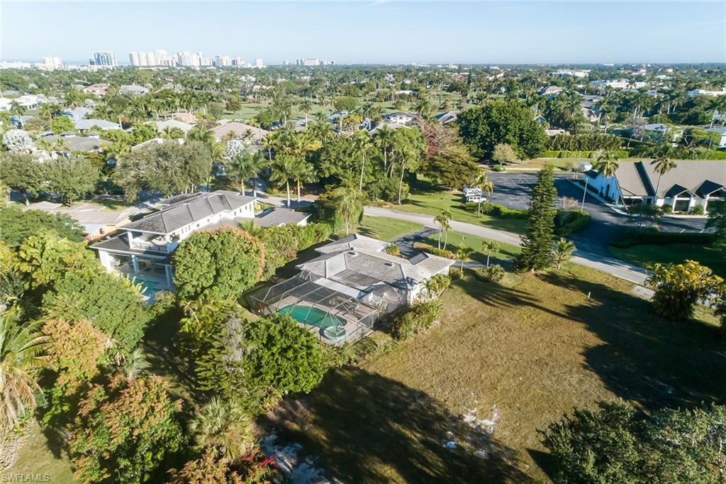 700 Bow Line Drive Naples, FL 34103 - Photo 10 of 18 an aerial view of residential house with outdoor space and swimming pool