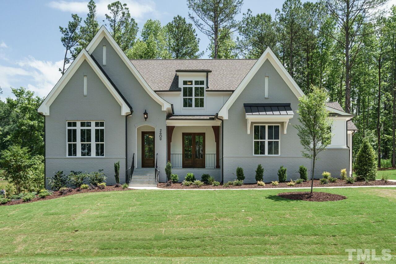 2609 Sanctuary Wds Lane Raleigh, NC 27606 - Photo 1 of 38 a front view of a house with a yard