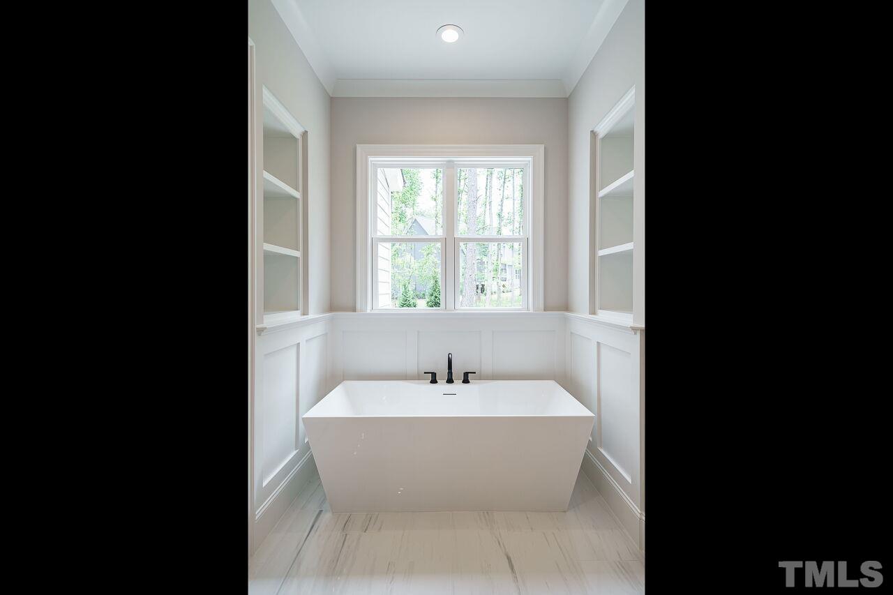 2609 Sanctuary Wds Lane Raleigh, NC 27606 - Photo 19 of 38 a bathroom with a sink and a bathtub