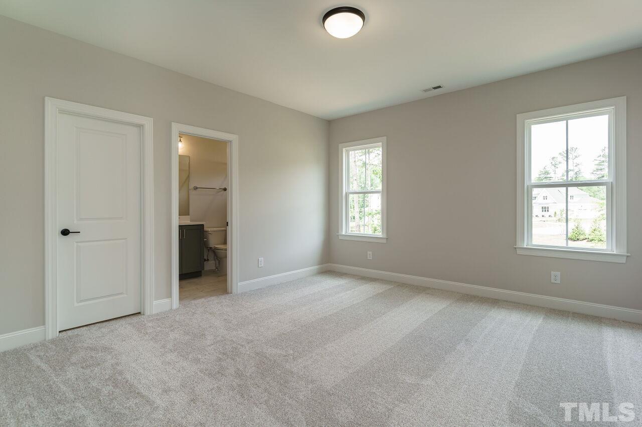 2609 Sanctuary Wds Lane Raleigh, NC 27606 - Photo 26 of 38 an empty room with windows and closet