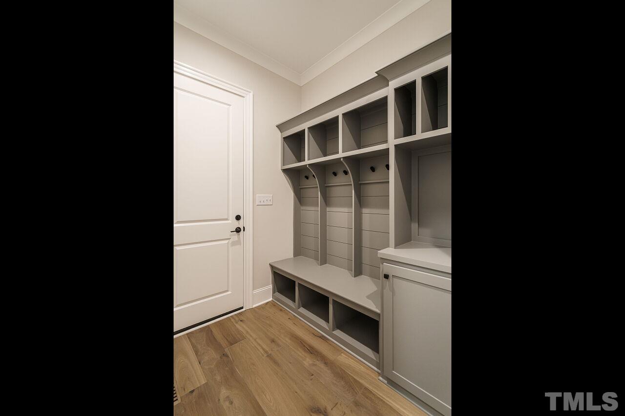 2609 Sanctuary Wds Lane Raleigh, NC 27606 - Photo 34 of 38 a view of walk in closet with empty racks