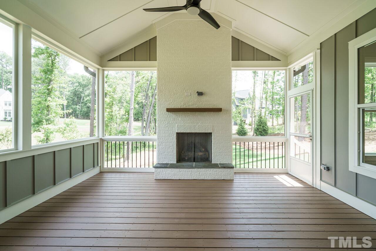 2609 Sanctuary Wds Lane Raleigh, NC 27606 - Photo 35 of 38 a view of a room with wooden floor and fireplace