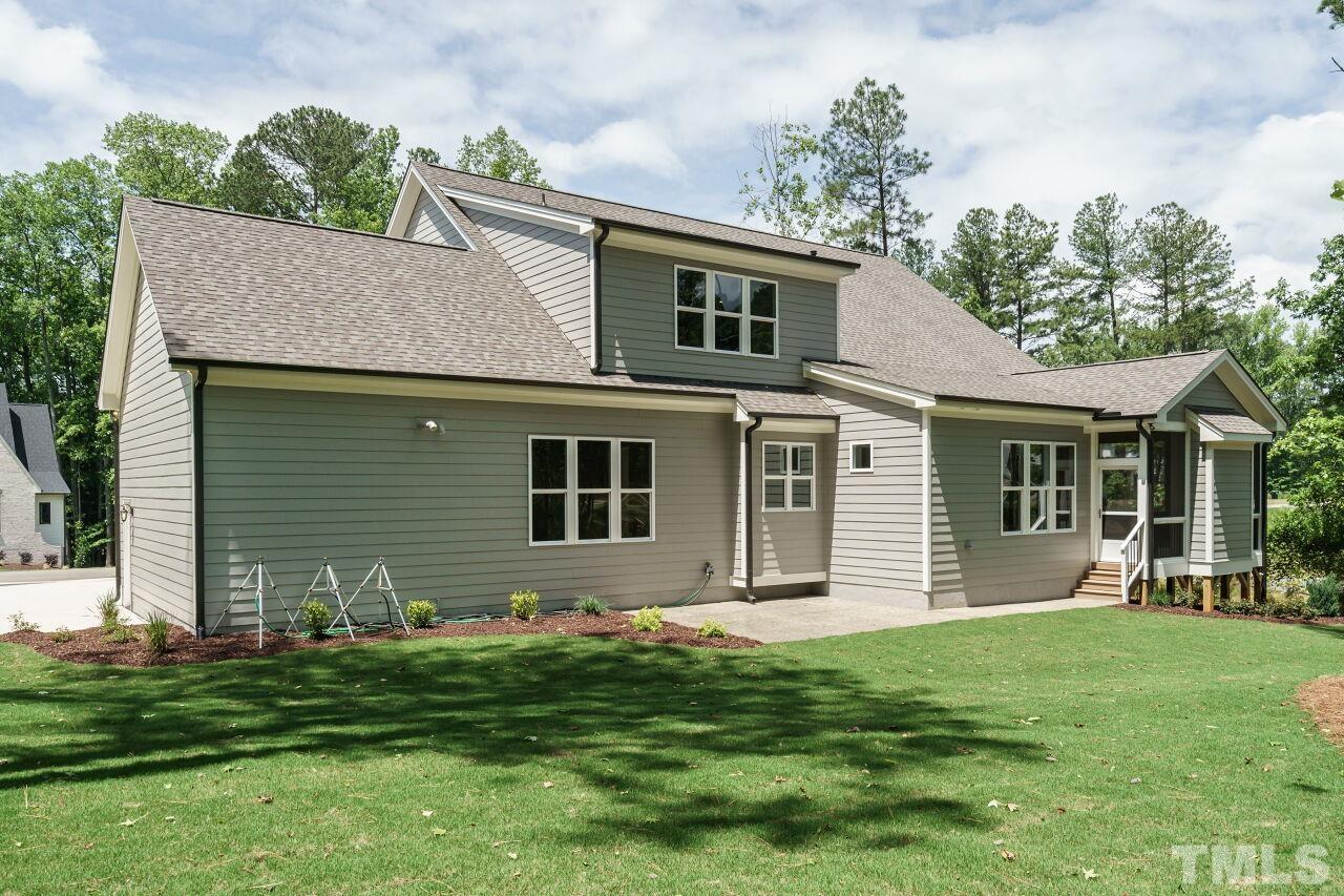 2609 Sanctuary Wds Lane Raleigh, NC 27606 - Photo 36 of 38 a front view of a house with a garden and yard