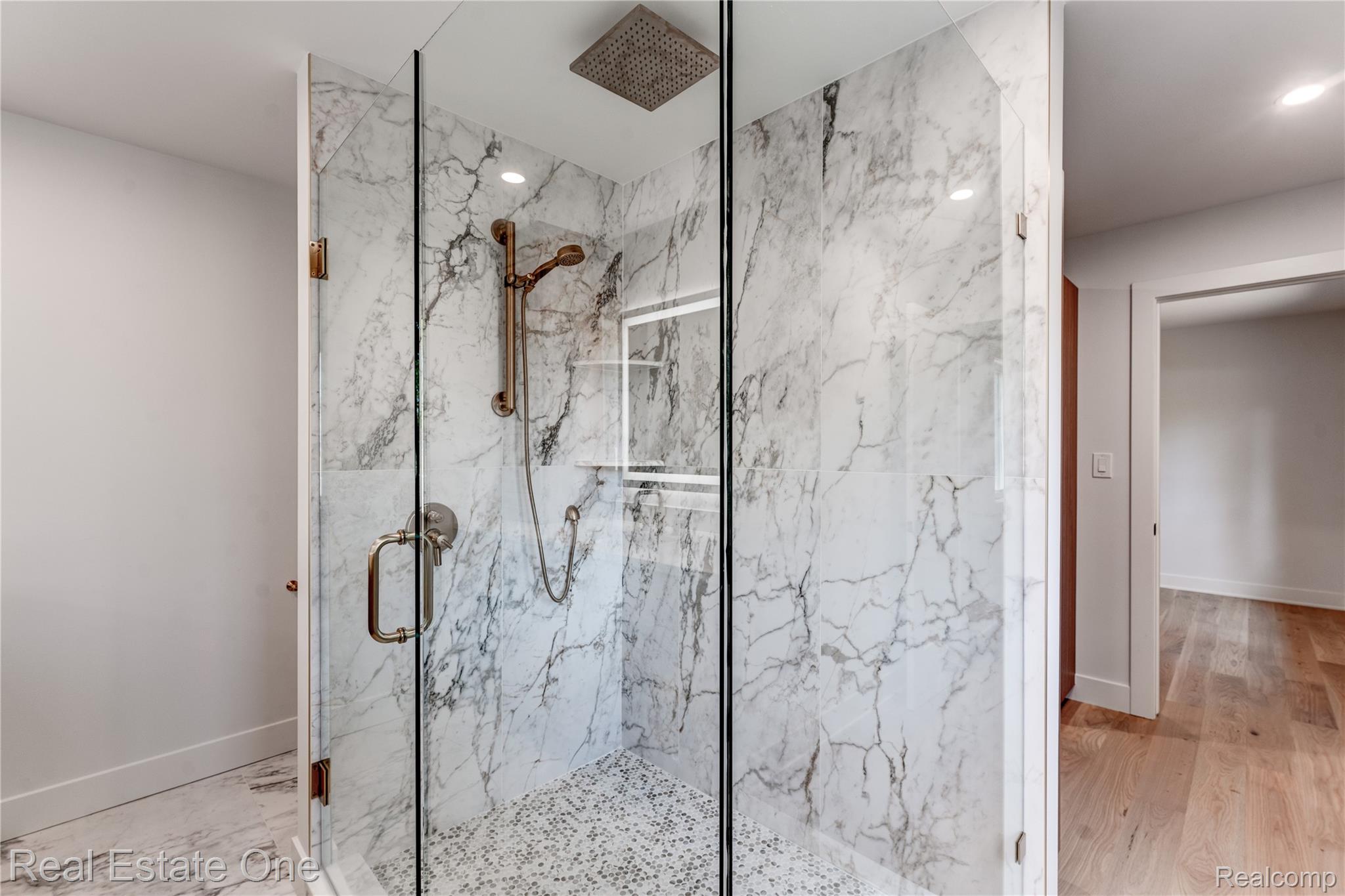786 South Cranbrook Road Bloomfield Hills, MI 48301 - Photo 24 of 38 Bathroom featuring a marble finish shower and light wood-style floors