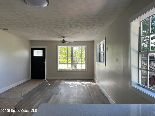 an empty room with windows