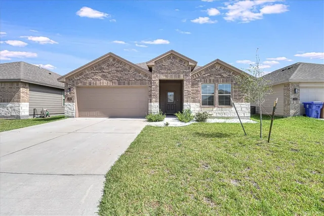 a house view with a garden space