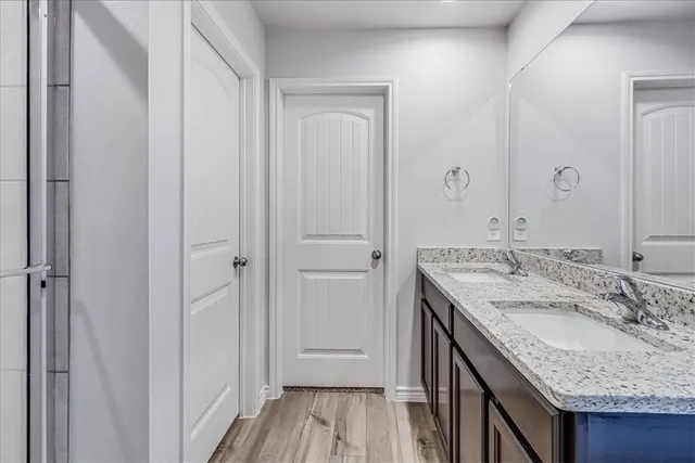 a white toilet sitting next to a small bathroom